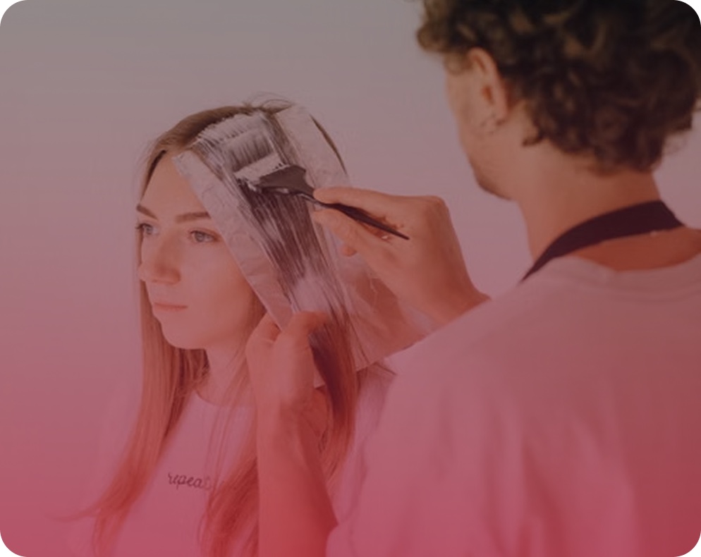 A stylist applying colour