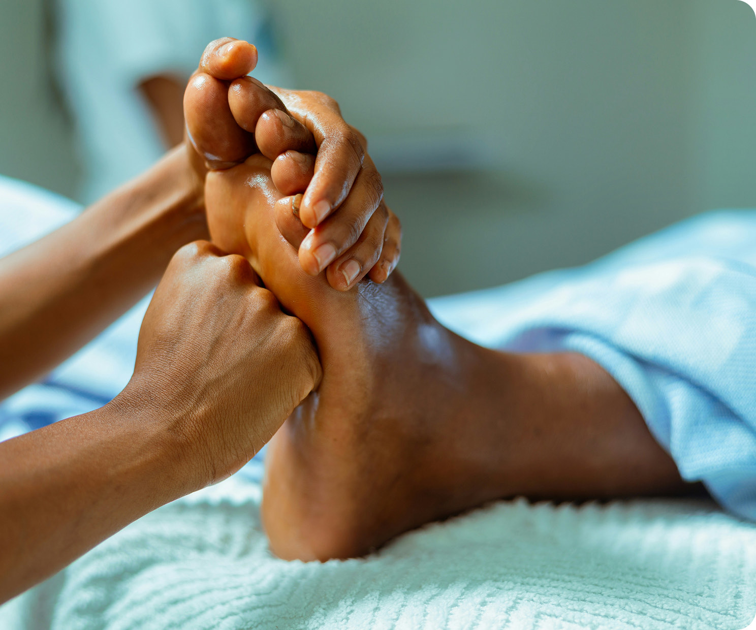 A therapist working on a client's feet