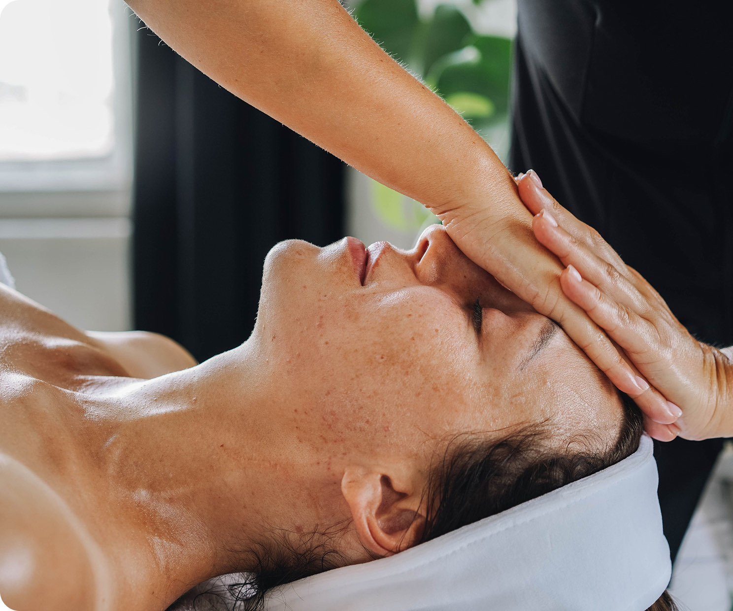 A therapist massaging a client's shoulders