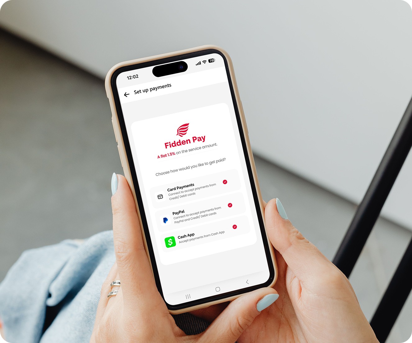 A provider checking her Fidden Pay set-up on her phone between clients